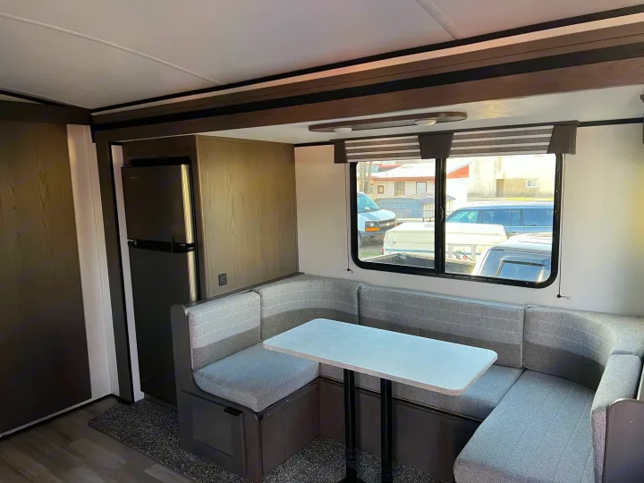 RV rental interior: cozy dinette area with fridge, perfect for travel comfort.. Other Other 2021