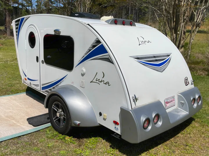 This white Luna teardrop RV camper with blue accents is ready for your next rv rental outdoor adventure.. InTech RV InTech RV Trailer 2018