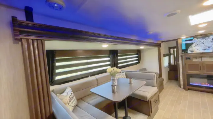Step inside this cozy rv rental! Features a comfy dinette, entertainment center, and blue accent lighting for a modern feel.. Forest River Cherokee Grey Wolf 2020