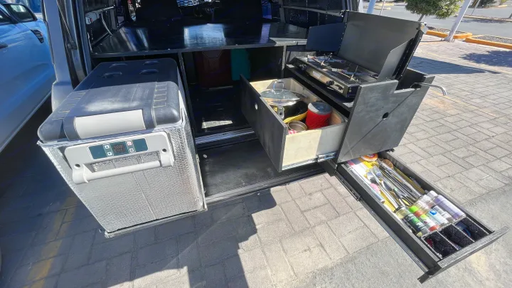 Compact RV rental overlanding setup: portable fridge, pull-out kitchen, stove & cutlery drawers for easy camping.. Toyota LandCruiser HJ61 VX 1989