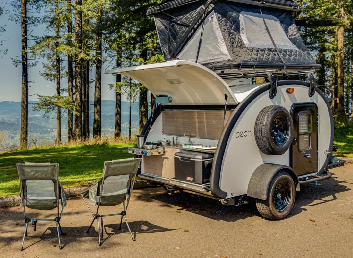 This RV rental offers a compact outdoor kitchen and rooftop tent, perfect for scenic camping adventures.. Bean Trailer Bean Stock 2022