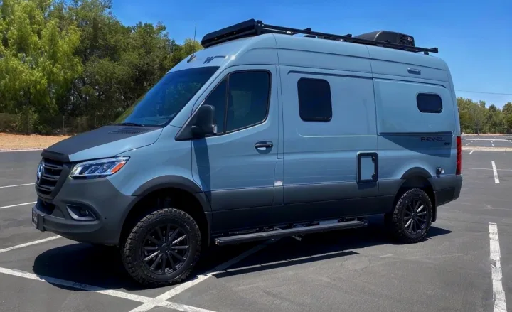 Winnebago Revel 4x4 Sprinter van, a versatile grey RV rental camper, parked outdoors on asphalt.. Winnebago Revel 2022