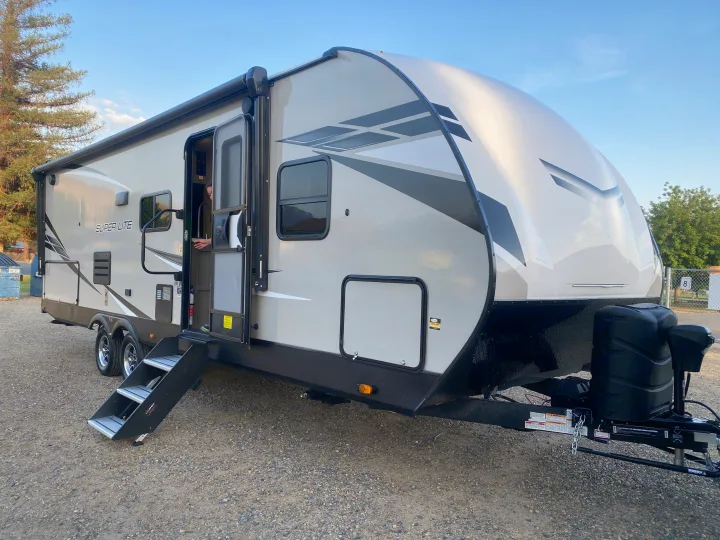 This sleek, light-colored "SUPER LITE" RV rental travel trailer is ready for your next camping adventure.. Starcraft Super Lite 2022