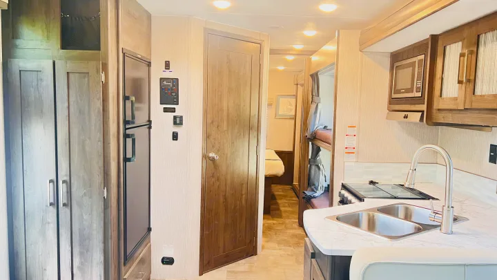 Experience compact living in this functional RV rental! It features a full kitchen, refrigerator, bunk beds, and control panel.. Forest River Coachmen Pursuit 2022