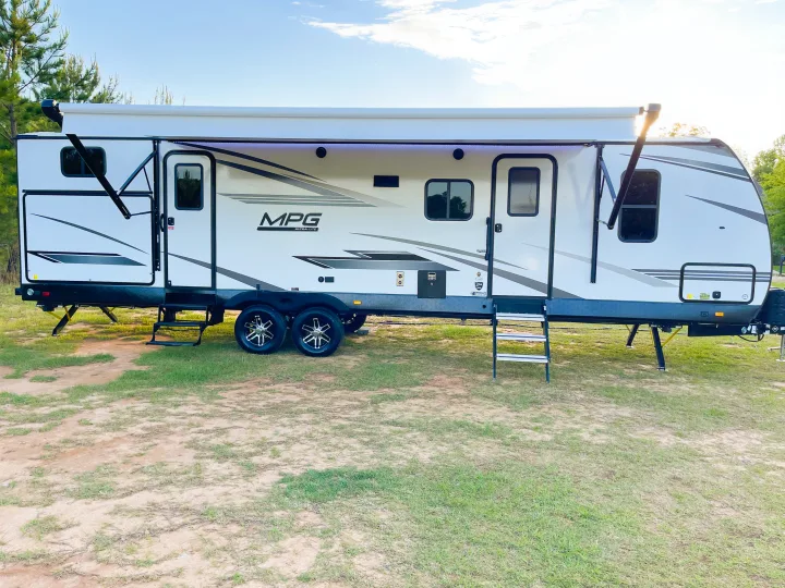 Modern white & gray MPG travel trailer, ready for your next RV rental adventure!. Cruiser RV MGP 3100BH 2022