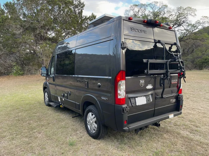 Explore in style! This dark grey Ram ProMaster "Scope" RV rental has a bike rack, solar, & is ready for adventure.. Thor Scope 18M 2022