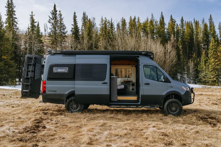 This grey camper van, with its customized interior and off-road features, is ideal for your next RV rental adventure in nature.. Mercedes-Benz Sprinter 2021