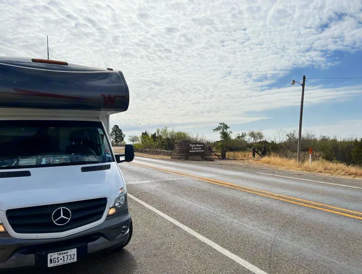 RV rental at Palo Duro Canyon entrance in Texas, ready for park adventure.. Winnebago Vita 2019