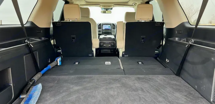 Spacious SUV interior, seen from the rear cargo area with third-row seats folded flat, perfect for rv rental trips.. Ford Ford Expedition 2021