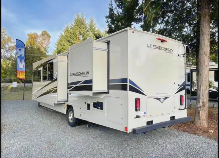 This beige Leprechaun motorhome, with extended slide-outs, is ready for your next rv rental adventure!. Coachmen Leprechaun 2022