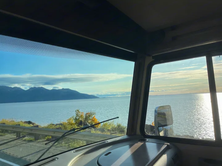 Breathtaking water & mountain views from an RV rental, seen from inside the motorhome windshield.. Winnebago Vista 2022