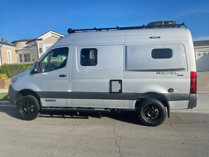 Silver Winnebago Revel 4x4 camper van, ready for your next RV rental adventure or road trip.. Winnebago Revel 2022