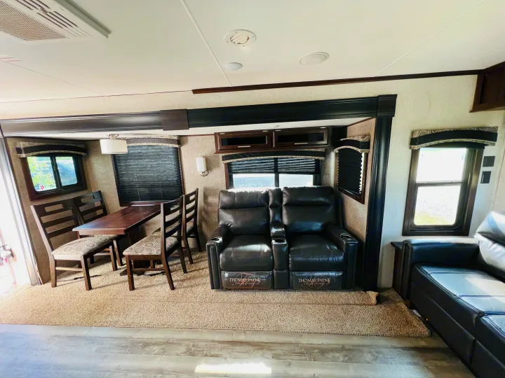 This RV rental offers a spacious interior with a dining area and luxurious Thomas Payne recliners, perfect for cozy travels.. Jayco Jay Flight 2019
