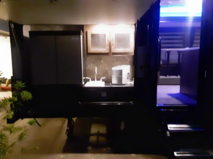 Experience comfort in this RV rental! Features a complete outdoor kitchen (sink, fridge, ice maker) & blue-lit interior steps.. Forest River Cherokee Grey Wolf 2020