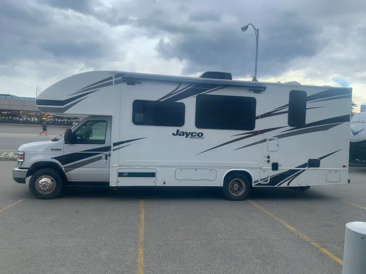 A sleek white Jayco Redhawk Class C motorhome, perfect for your next RV rental road trip.. Jayco Redhawk 2020