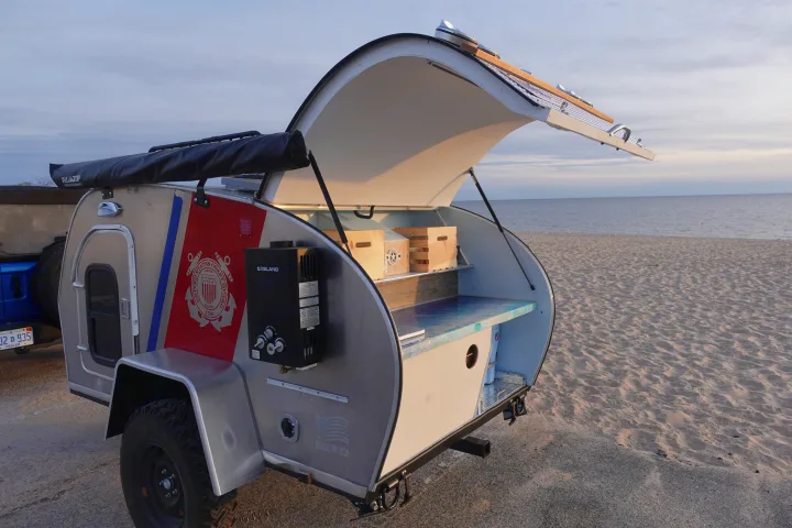 Experience unique beach camping with this compact RV rental! Teardrop camper features an open outdoor kitchen.. Second Wind Freedom 2020