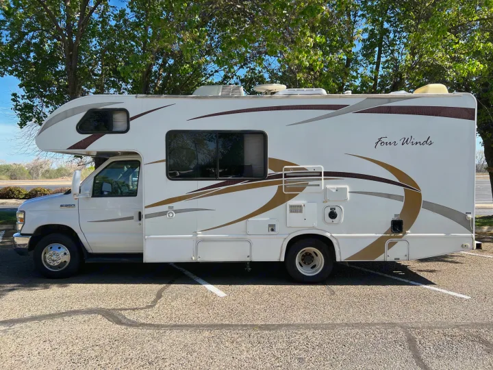 Experience travel freedom with this white Four Winds Class C RV. An ideal RV rental for your next road trip.. Thor Four Winds 2013