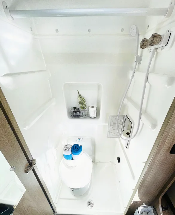 Toilet and wet bath shower bathroom with waterproof TP compartment. For hot showers and the call of nature.. Winnebago Solis 2023