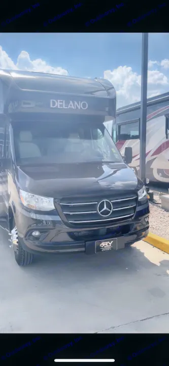 A black Mercedes-Benz Sprinter Delano RV, a sleek motorhome ideal for RV rental.. Thor Delano Sprinter 2020