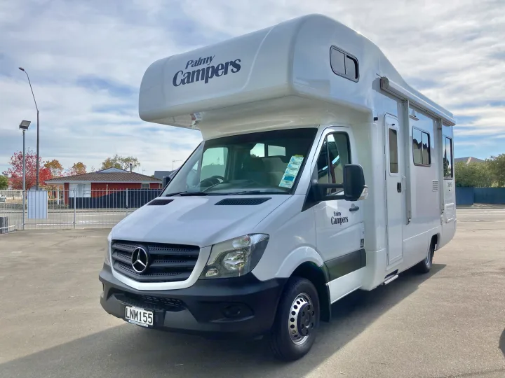 White Mercedes-Benz motorhome by Palmy Campers for RV rental, parked on an outdoor lot.. Mercedes-Benz Sprinter 2018