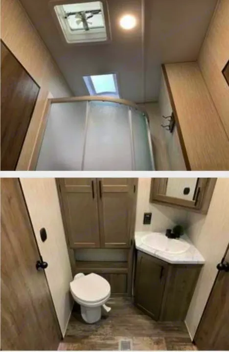 View the compact bathroom in this RV rental, showcasing a corner shower with frosted doors, toilet, vanity sink, and built-in storage.. Forest River Cherokee Wolf Pack Toy Hauler 2020