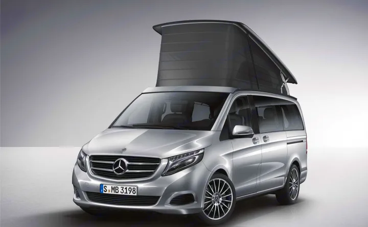 Silver Mercedes-Benz camper van with pop-up roof, perfect for an RV rental getaway and travel.. Mercedes Marco Polo 2022