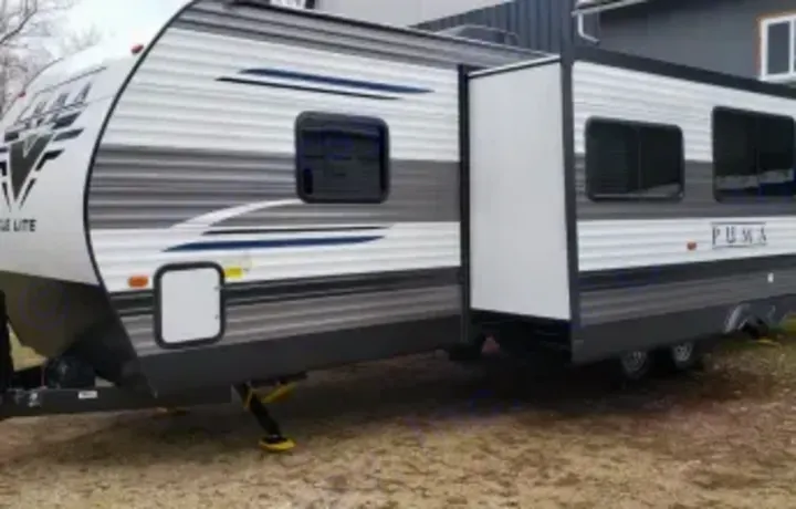 Outside view of slide. Forest River Palomino Puma XLE Lite 2021