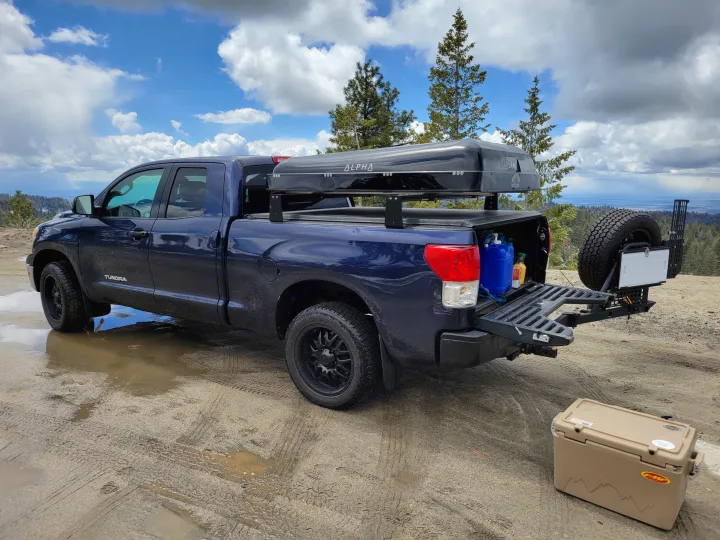 Exploring nature with a rigged-out truck, like an **rv rental** alternative! This blue Tundra features an Alpha rooftop tent & rear storage.. Toyota Tundra 2011