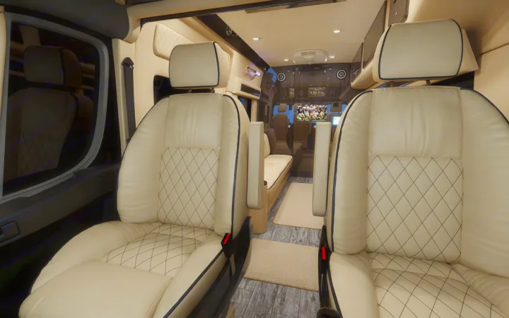 Experience luxury travel in this RV rental's spacious interior with cream quilted seats, entertainment screens, and wood flooring.. Ultimate Toys Ultimate Camper 2023