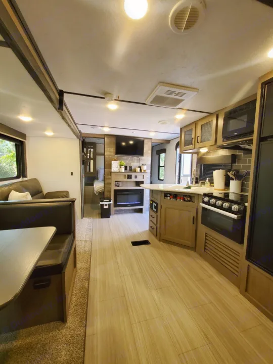 Spacious RV rental interior with kitchen, dining, and living areas for a comfortable journey.. Keystone RV Hideout Luxury 2021