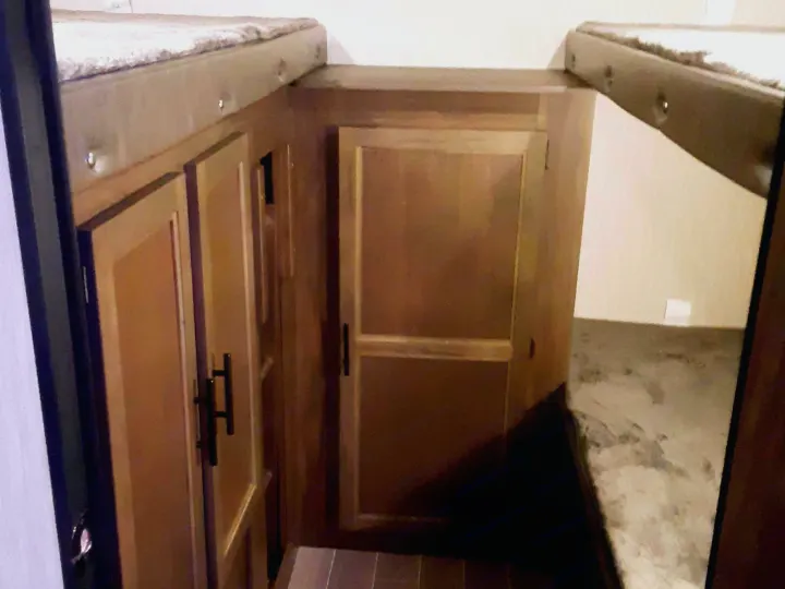Cozy RV rental bunk area featuring wooden cabinetry and upper/lower beds.. Forest River Cherokee Grey Wolf 2020
