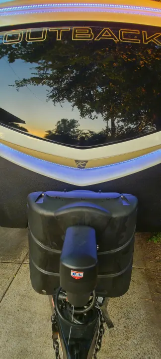 Overhead view of an Outback boat's bow on a trailer with propane cover, ready to tow for your rv rental adventure.. Keystone RV Outback 2021