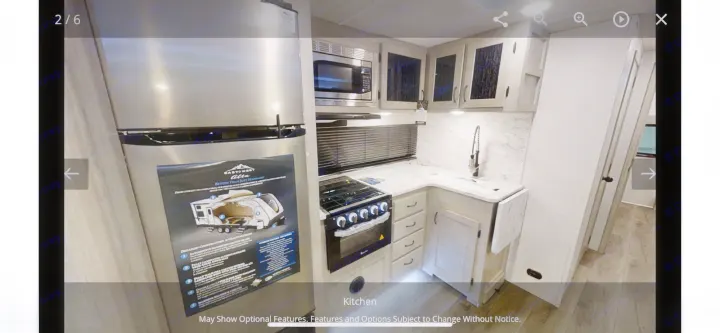 Explore this RV rental's modern kitchen! Features stainless steel appliances, ample counter space, and light wood cabinetry.. Forest River Other 2022