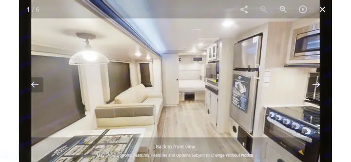 Interior of an RV rental, featuring a living/dining area, fully equipped kitchen with large appliances, and a rear bedroom.. Forest River Other 2022