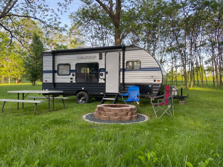 Enjoy your RV rental! This campsite features a Wolf Pup travel trailer, picnic table, fire pit, and chairs.. Forest River Cherokee Wolf Pup 2019