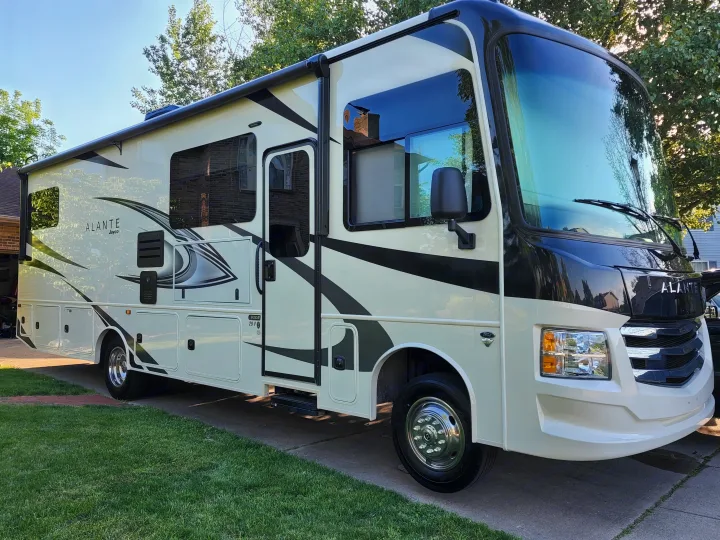 This cream and black Jayco Alante RV, a spacious motorhome, is ready for your next rv rental journey.. Jayco Alante 2022