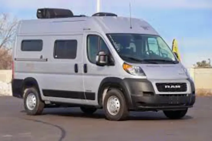 A silver Ram ProMaster camper van, an ideal RV rental for your next road trip or camping adventure.. Winnebago pocket 2023