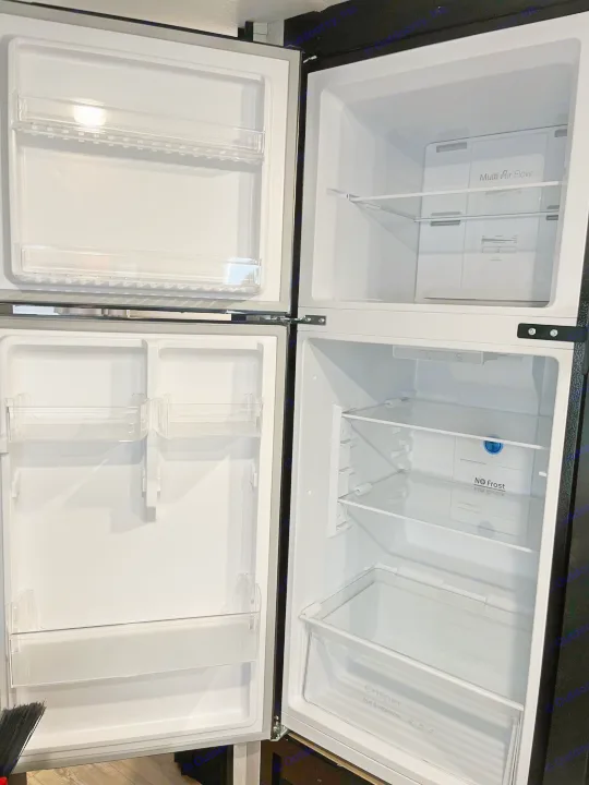 Spotless RV rental fridge & freezer, empty & ready for your trip. Features 'Multi Air Flow', 'No Frost', 'Crisper Box'.. Forest River Cherokee Grey Wolf Special Edition 2022