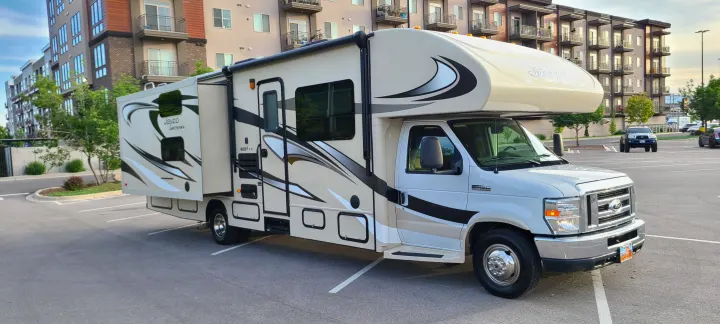 Clean Class C Jayco Greyhawk RV rental, beige and white, with slide-out. Perfect motorhome for your next adventure.. Jayco Greyhawk 2015