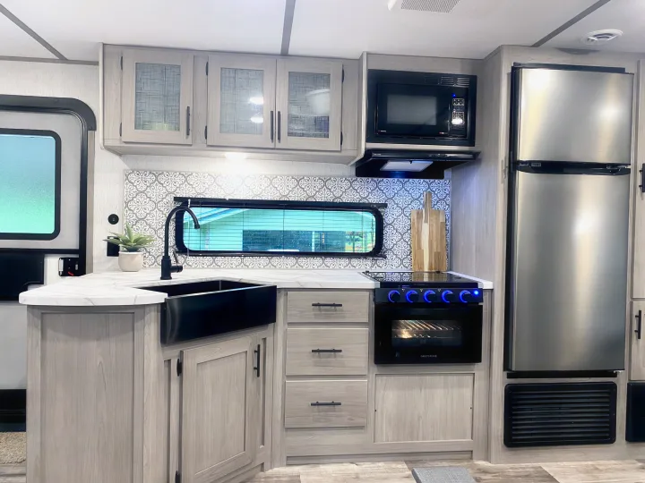 Beautiful modern kitchen with farm sink, gas stove/oven, huge window to take in the views.. Coleman Lantern 263BH 2022