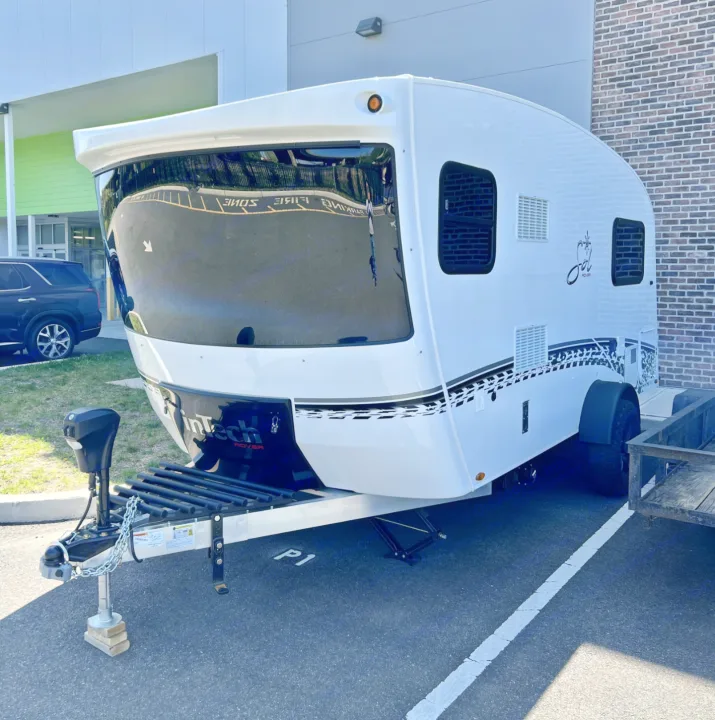 This sleek white "Sol" travel trailer is an ideal compact RV rental. A modern recreational vehicle.. Intech Sol Horizon Rover 2022