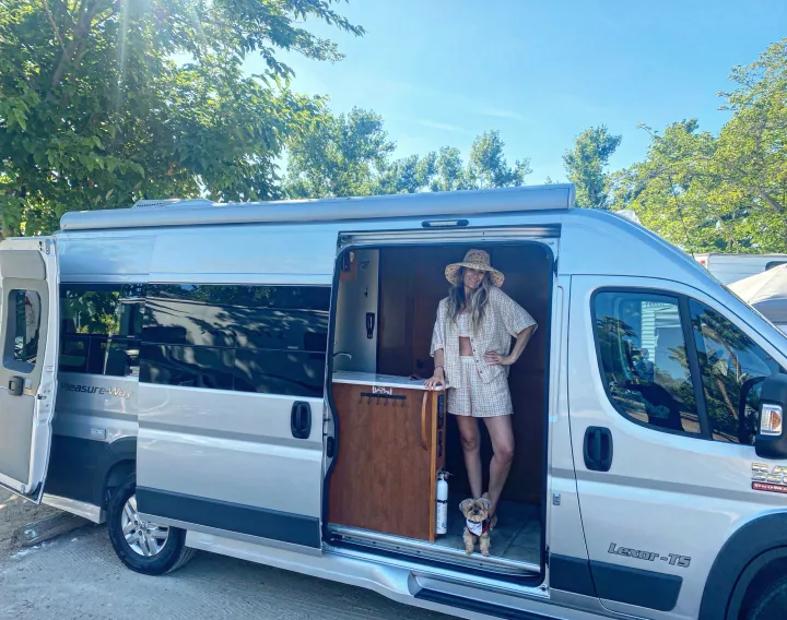Woman & dog in their Pleasure-Way camper van, perfect for an RV rental adventure.. Pleasure-Way Pleasure-Way Class B 2016