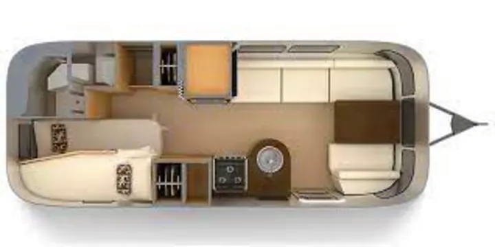 This RV rental floor plan details a travel trailer interior, featuring a dinette, kitchen, bath, and rear twin beds.. Airstream Flying Cloud 2022