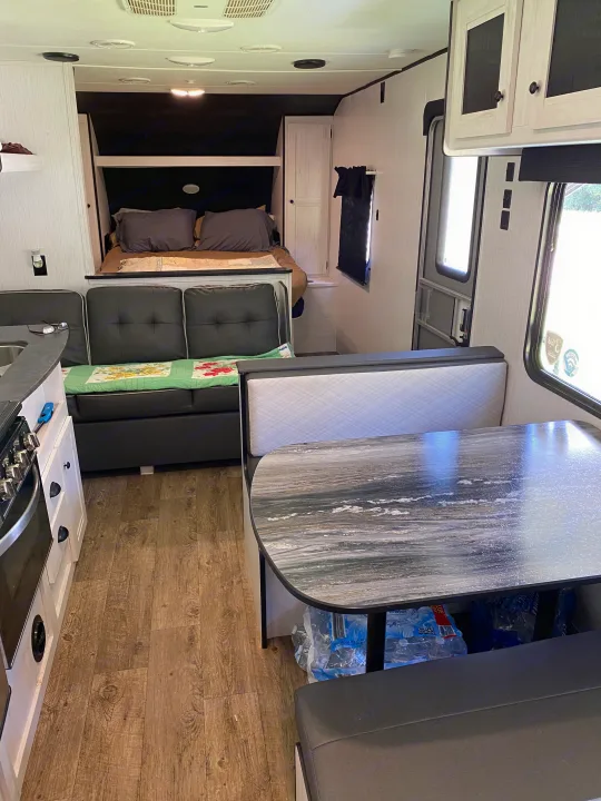 Step inside this spacious RV rental, featuring a full kitchen, comfortable dinette, and cozy sleeping area for your next adventure.. Heartland RVs Trailrunner 2021