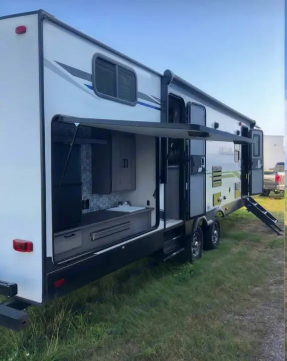 Outside cooking area. Showing bathroom door and living area door. Heartland RVs Mallard 2020