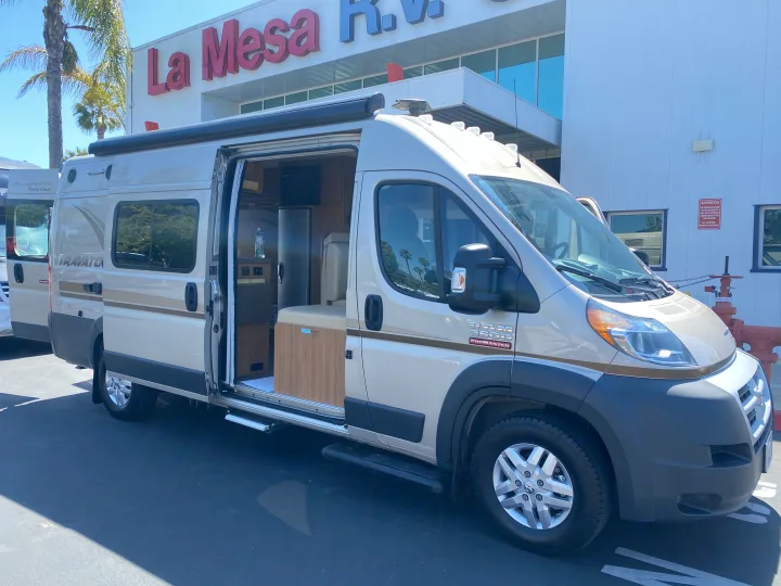 Winnebago Travato RV rental van, doors open to reveal interior, parked at La Mesa RV. Perfect for travel & adventure.. Winnebago Travato 2014