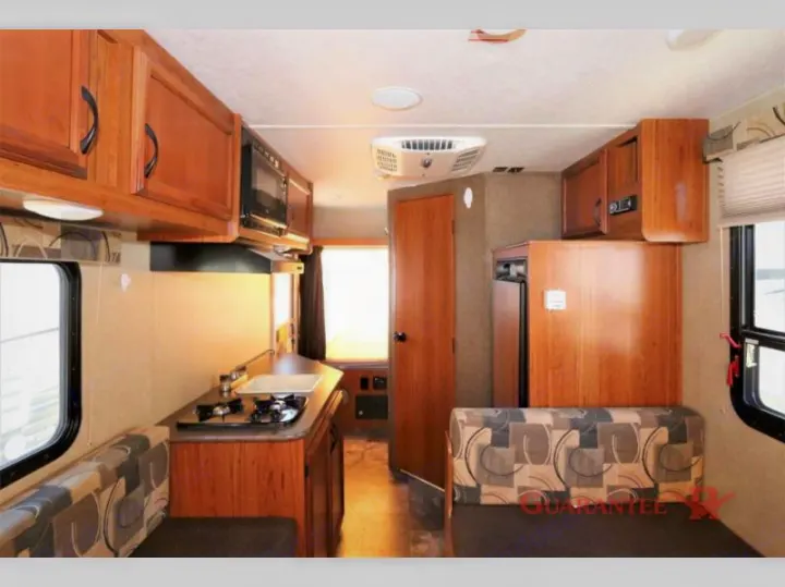 Bright RV rental interior featuring a well-equipped kitchen and comfortable dinette for your adventures.. Starcraft Launch 2016