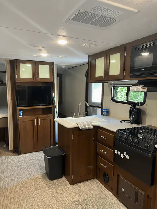 Kitchen and dinette area have TV, Radio and a nice amount of room for your family fun. Forest River Acadia 2018