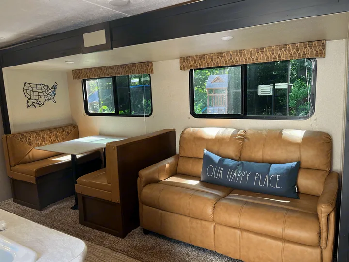 dining table and couch pull out into beds for extra room or enjoy while watching moveies, eating and playing games at night. . Forest River Acadia 2018