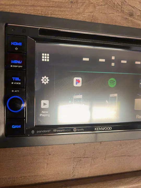 RV rental's Kenwood infotainment display, featuring apps like Spotify & Pandora for travel entertainment.. Forest River Shockwave 2022